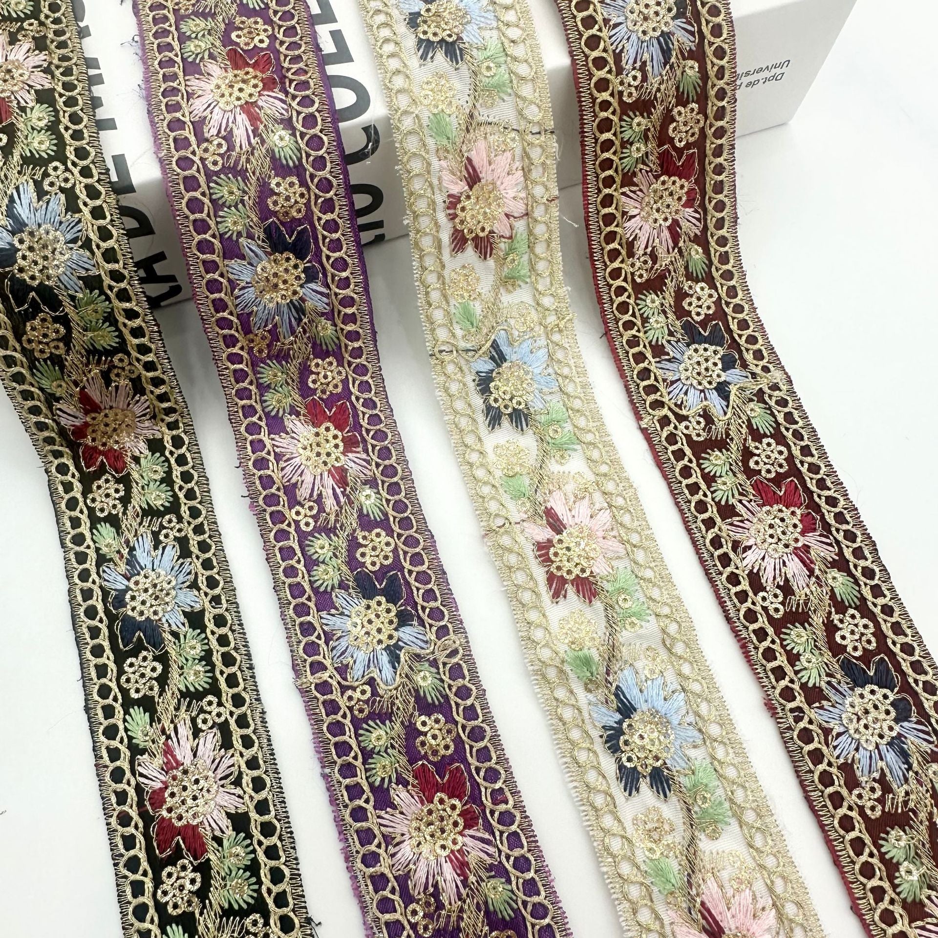 Ethnic sequin ribbon trim, dark navy, purple, and cream florals with gold edging
