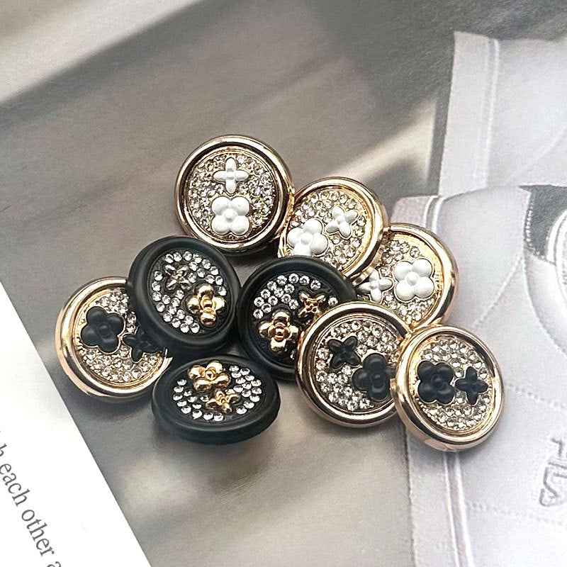 Round two-tone metal shank buttons, black faces with gold edging, floral cluster, 10 pcs