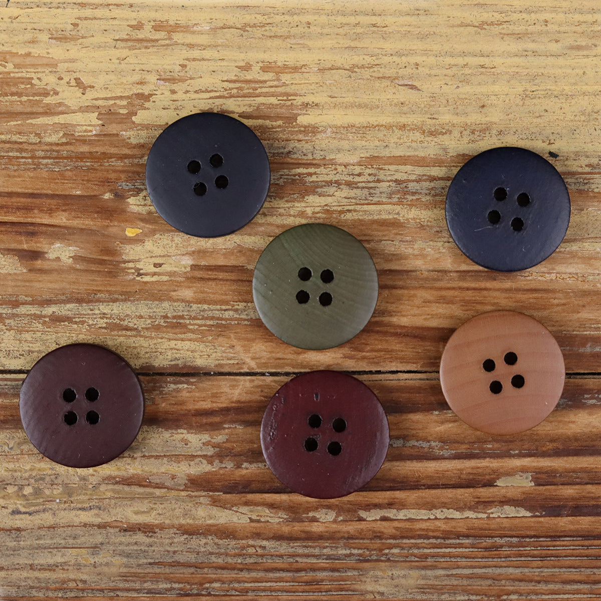 Assorted 4-hole round buttons, dark blue, olive, burgundy, and tan with four holes