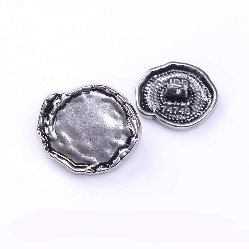 Antique silver metal button backs with central shank and textured border