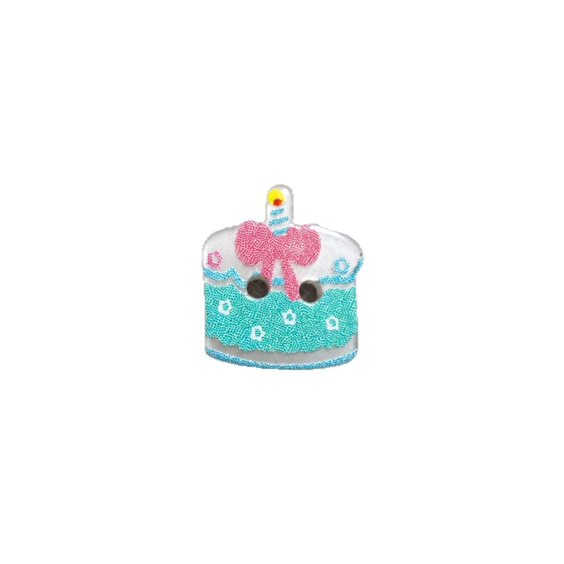 Resin cake button with light green base, pink bow and candle, two holes