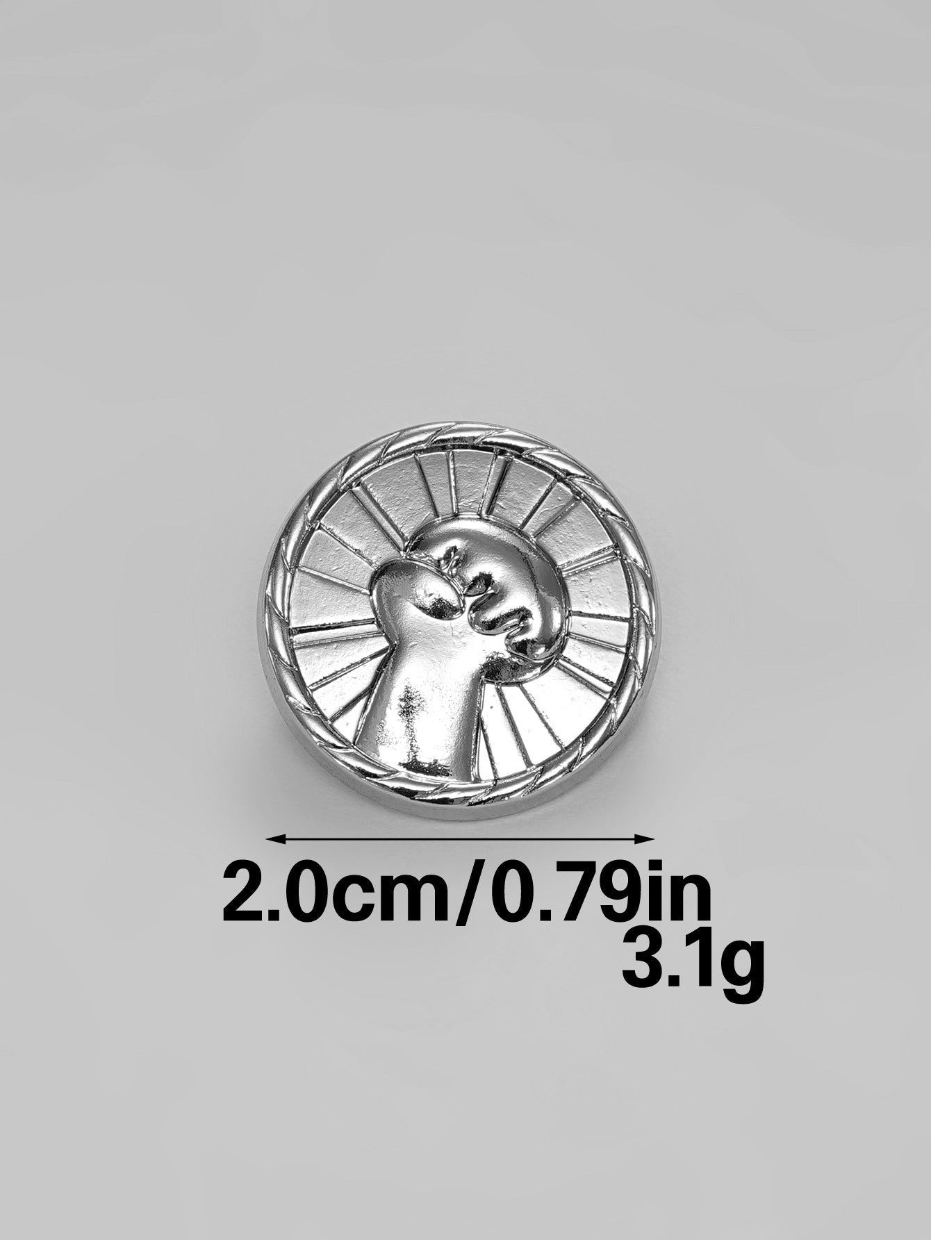 Silver round fist button with metal shank and textured back, raised design