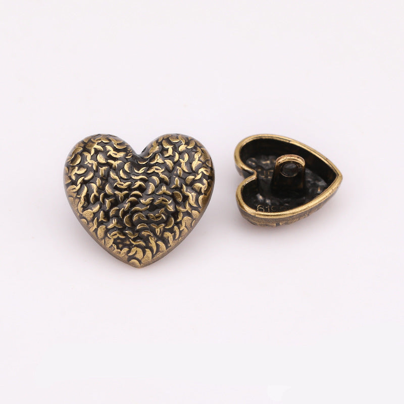 Heart-scale metal shank button, antique gold; front scale texture and back shank