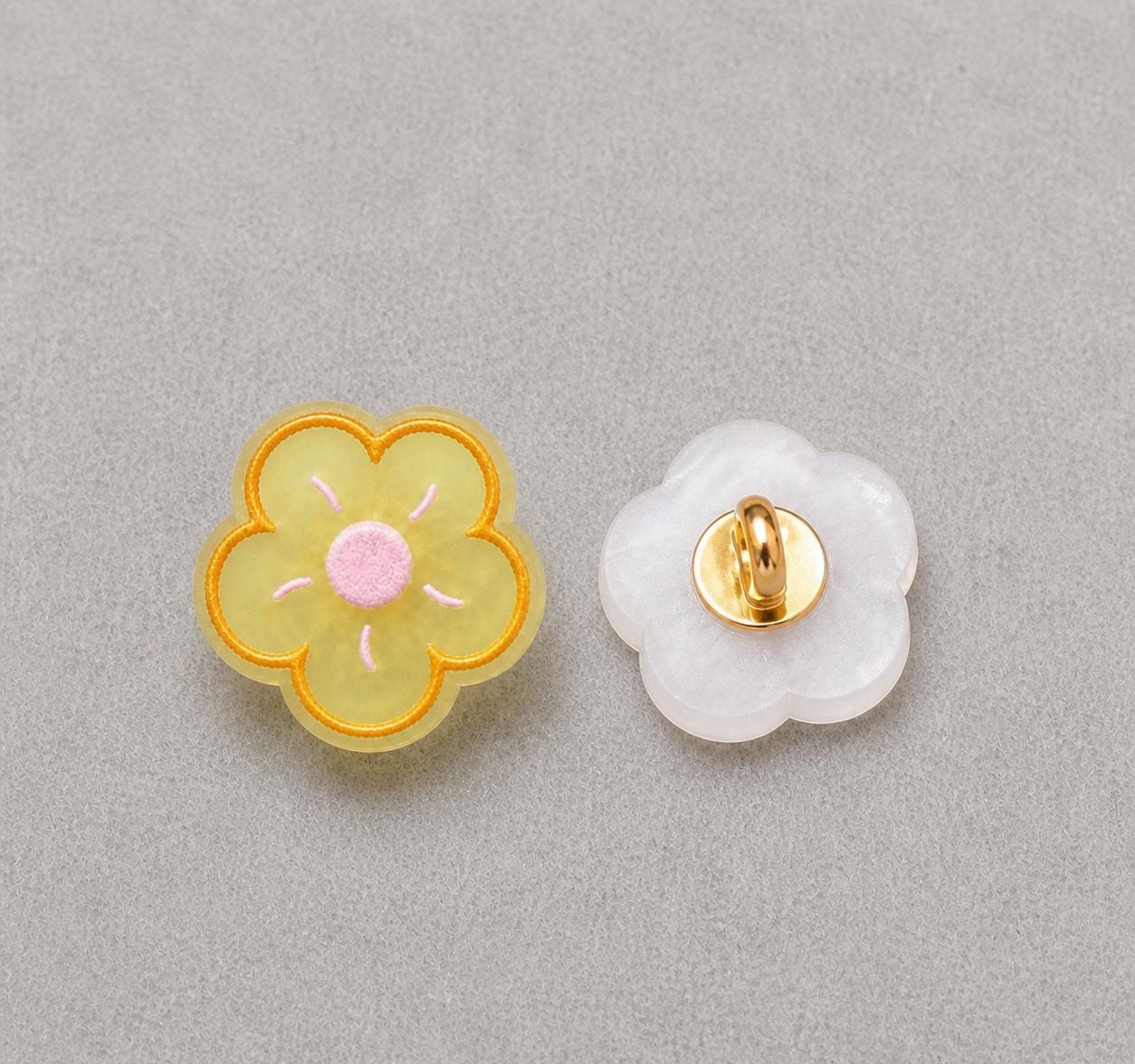 Floral resin shank button set: yellow flower front, translucent back