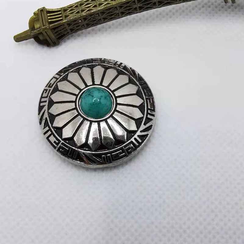 Turquoise-centered round alloy button with black-and-silver geometric floral border