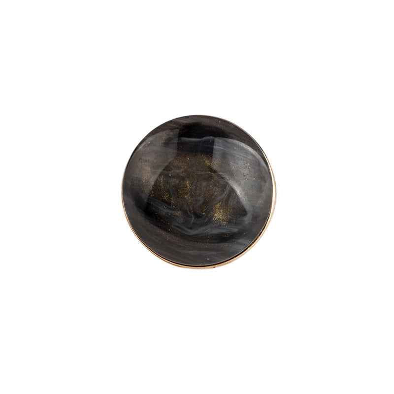 Black round resin button with metal backing and shank, glossy