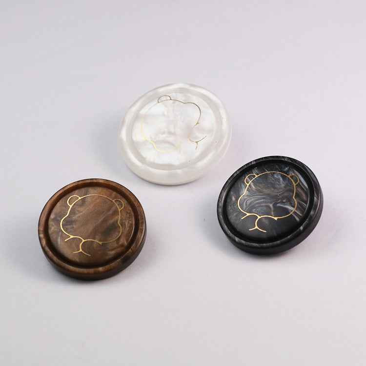 Bear resin shank buttons in brown, white, and black with gold cartoon line art