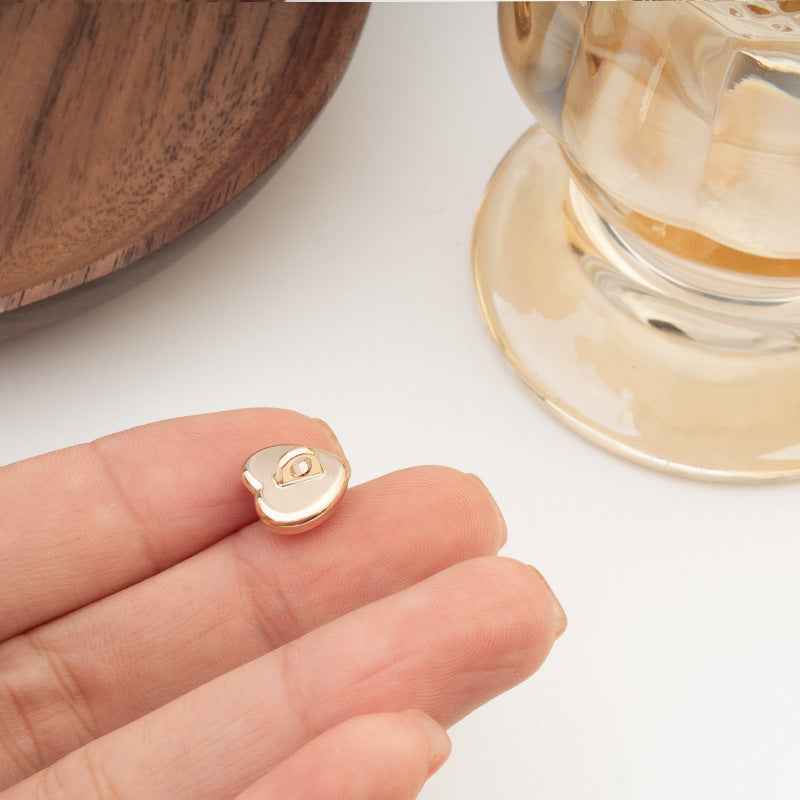 Heart-shaped buttons set, iridescent light panels with gold-tone edges, 5 shown in hand