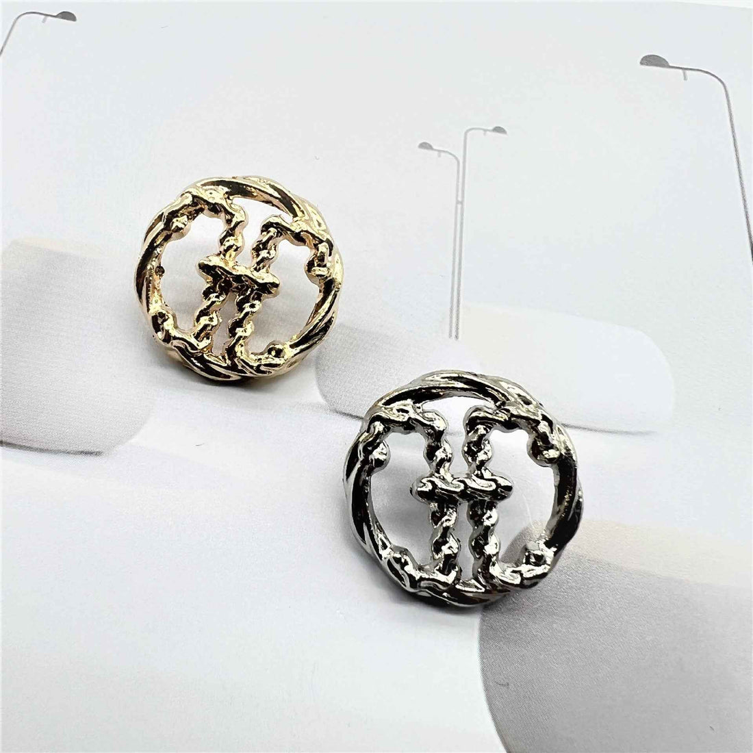 Vintage metal sewing buttons with raised H initial, gold and silver on card