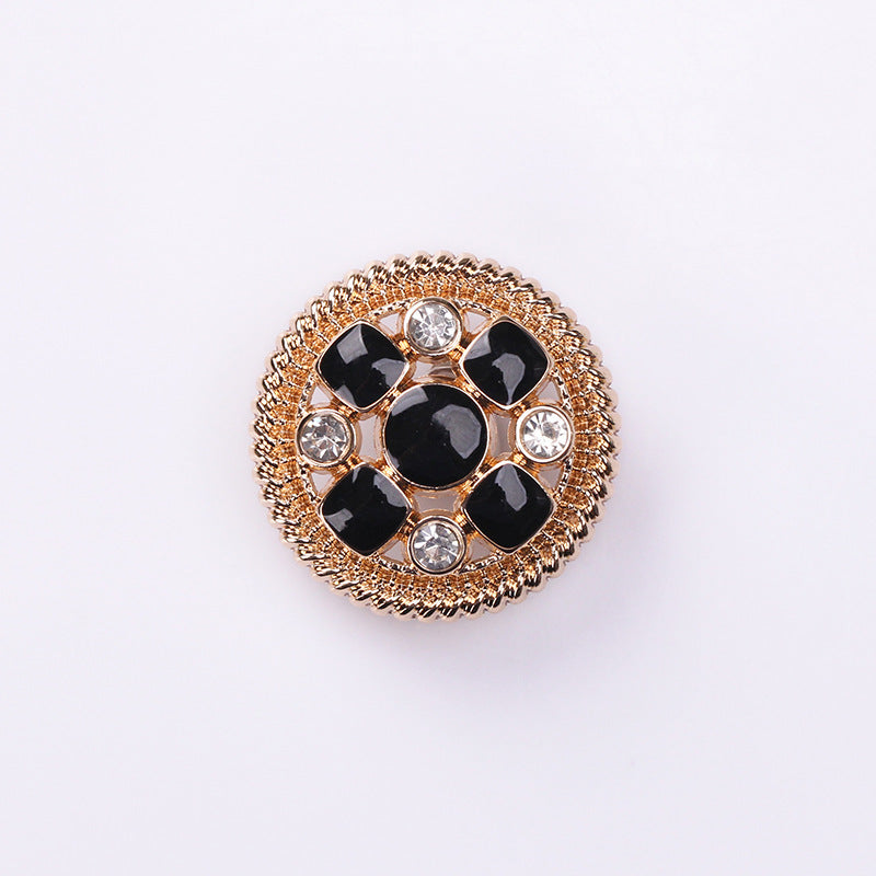 Round crystal shank button front: black enamel petals and clear rhinestones in gold