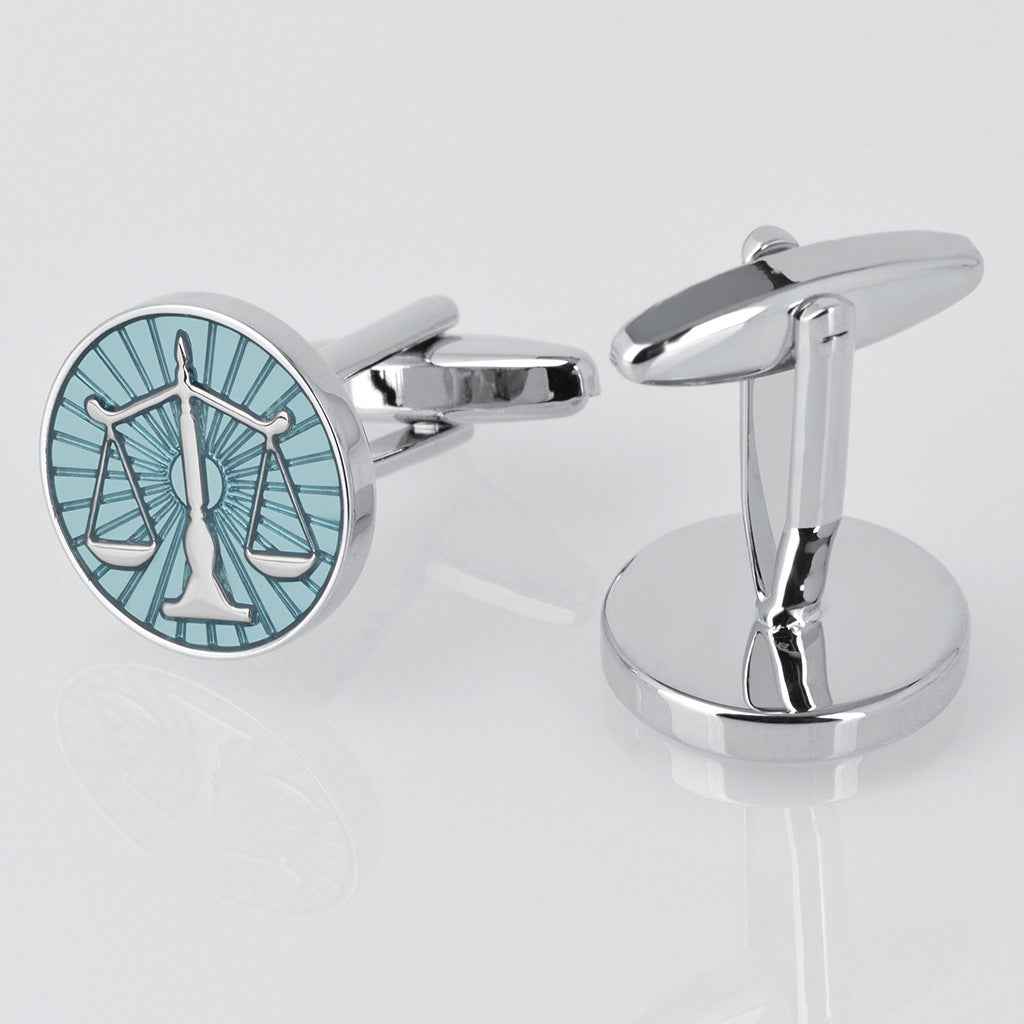 Blue balance scale cufflinks with silver-tone hinge back and circular face