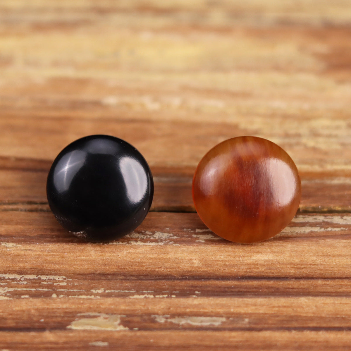 Round horn buttons, black and dark brown domed fronts with glossy finish