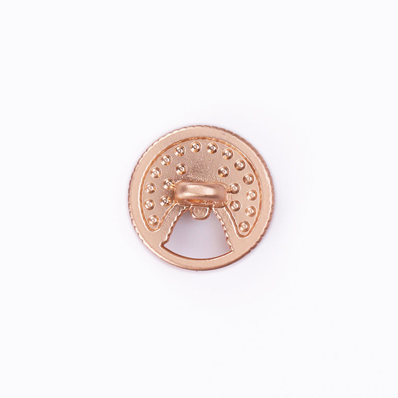 Sand gold round button back with hollow shank and evenly spaced rhinestone settings