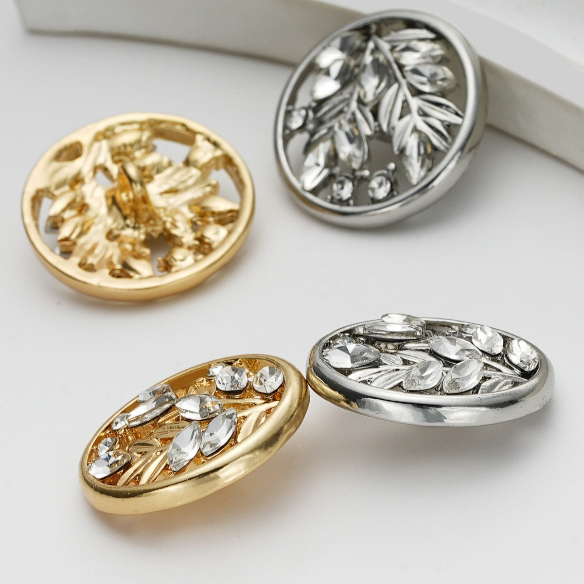Assorted round crystal flower metal shank buttons in gold and silver