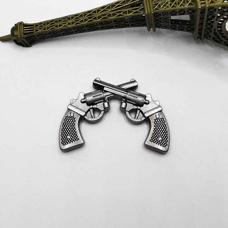 Antique silver double gun rivet studs with pistol motif, punk hardware