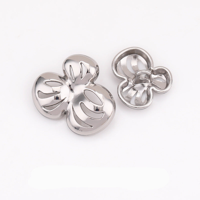 Hollow flower metal shank buttons, silver tone pair with loop shanks visible