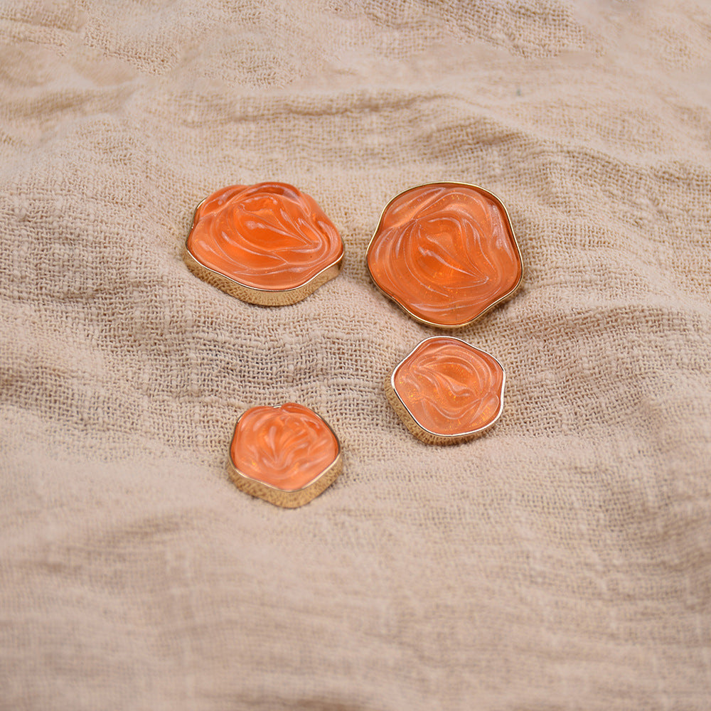 Transparent floral resin buttons, orange swirled resin with gold-tone metal edging