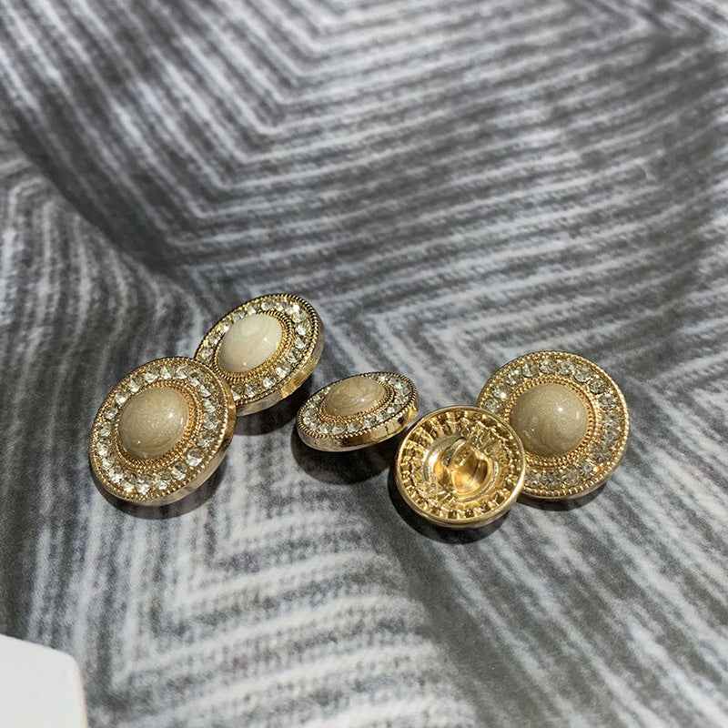 Set of round gold-tone buttons with rhinestone trim and beige centers, mixed angles