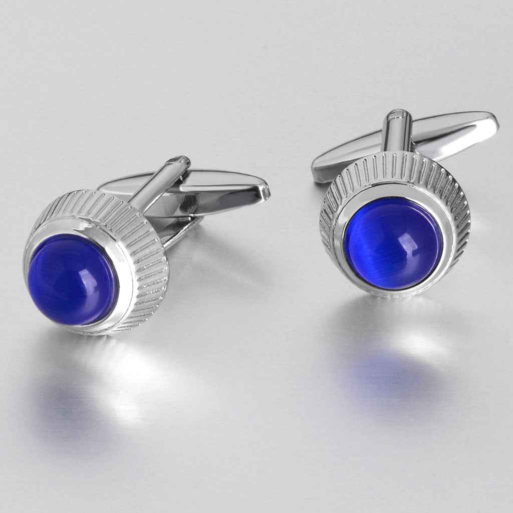 Round blue cat’s eye cufflinks with ridged silver bezel and hinged backs