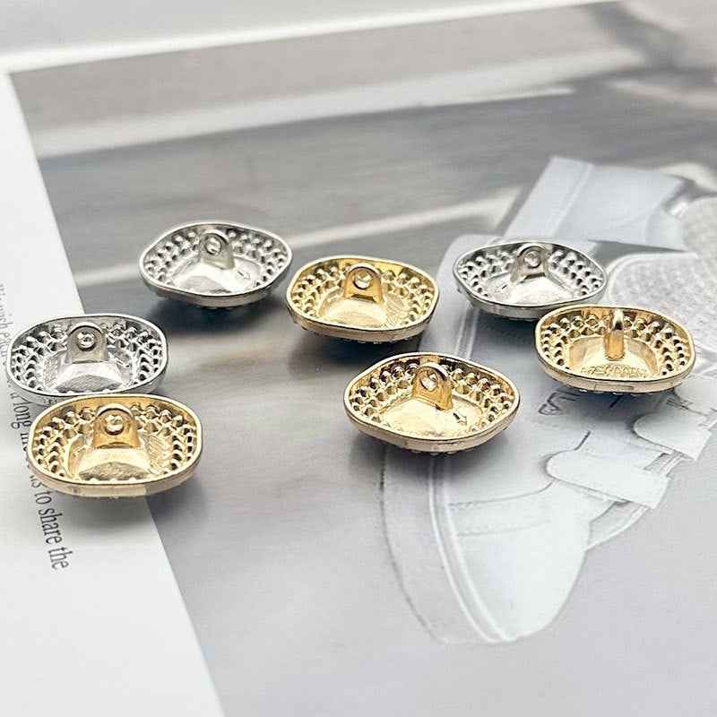Round shank buttons with rhinestone borders and gold/silver-tone settings for faceted center gems