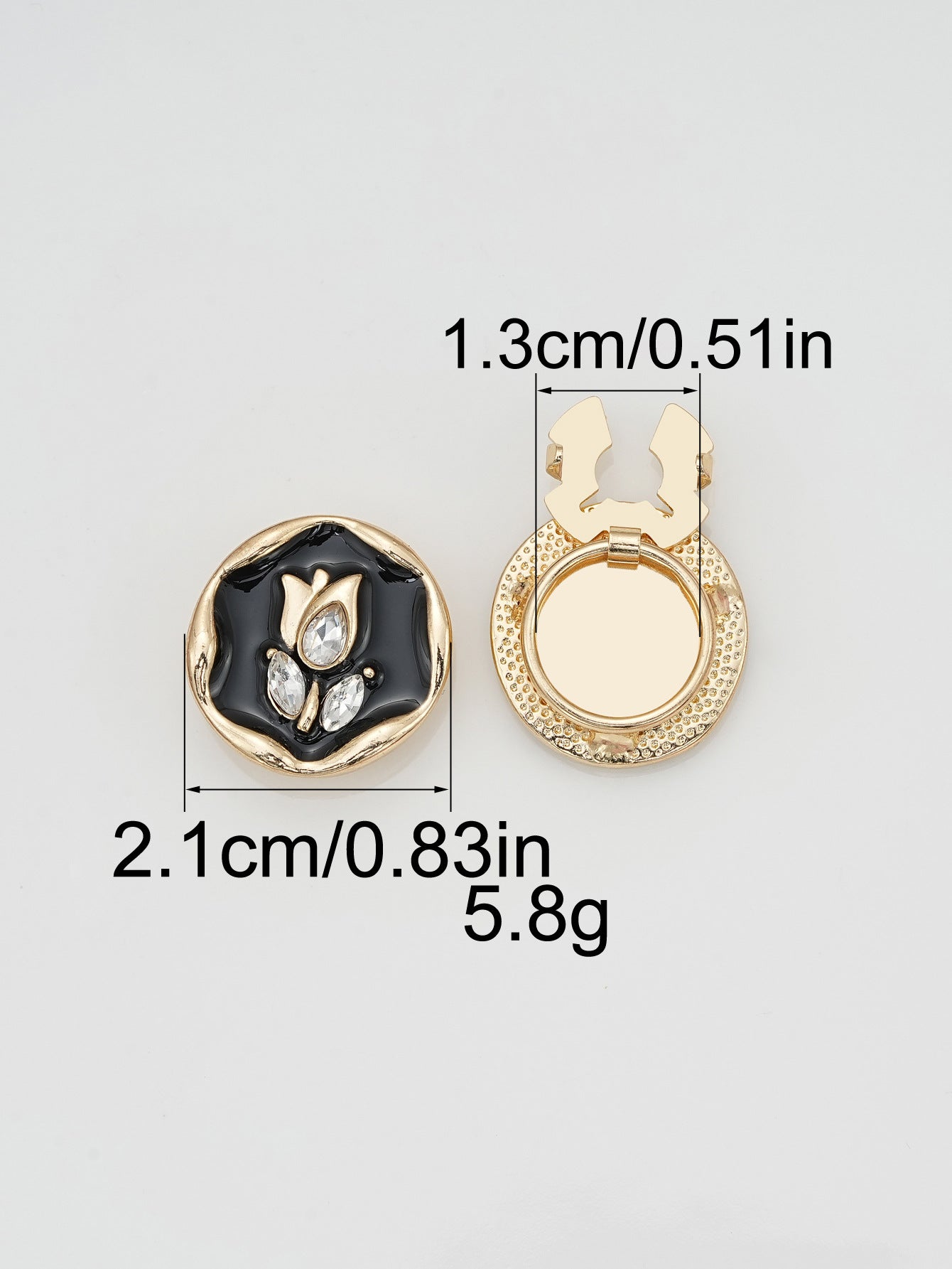 Irreguläre ovale Clip-Knöpfe: weißes Glas, schwarzes Emaille, goldener Metallrand