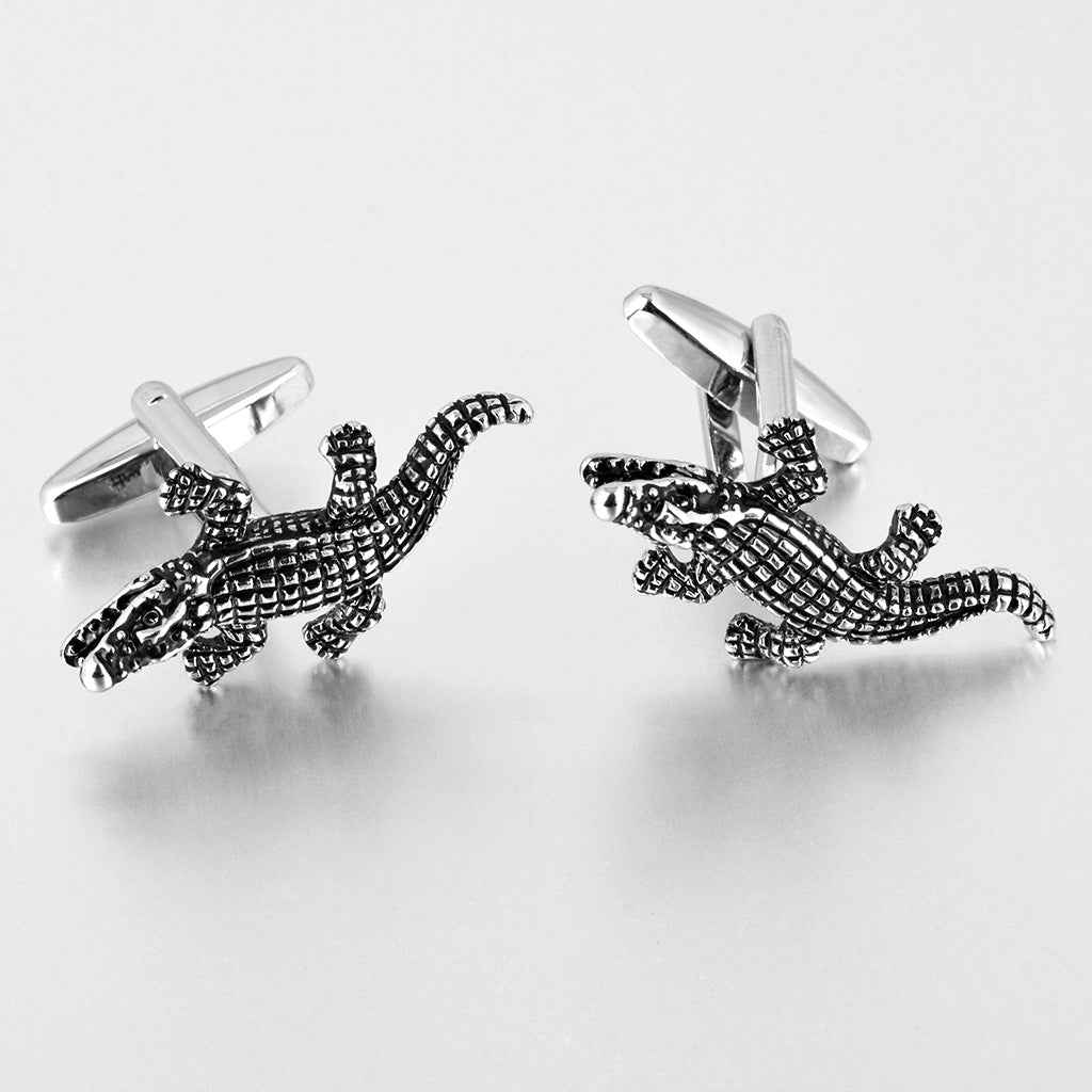 Pair of black crocodile texture cufflinks with polished silver posts
