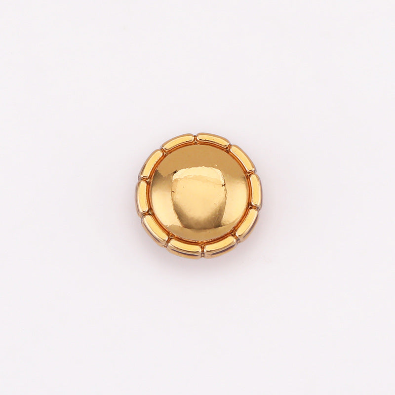 Gold domed round metal shirt button front with raised center dome