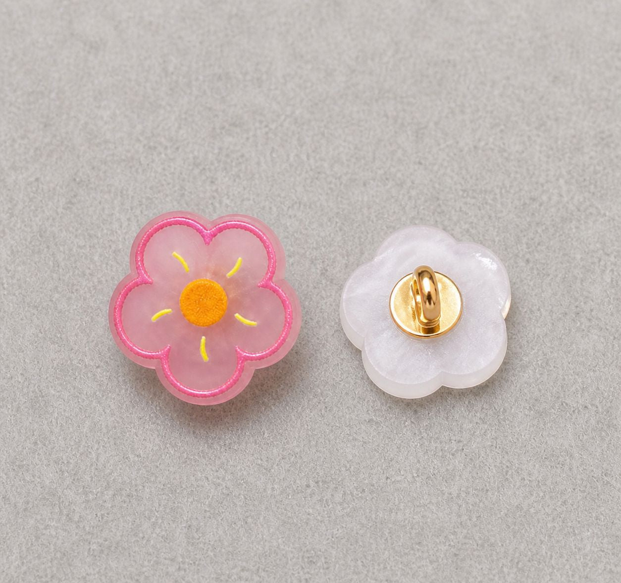 Floral resin shank button set: pink flower front, translucent back