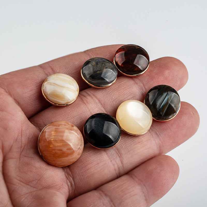 Assorted round resin buttons with metal backing and shank, mixed colors