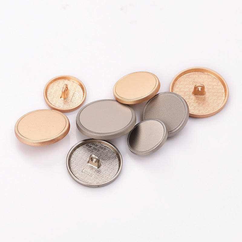 Assorted round metal shank buttons: sand gold and sand nickel, serrated edges