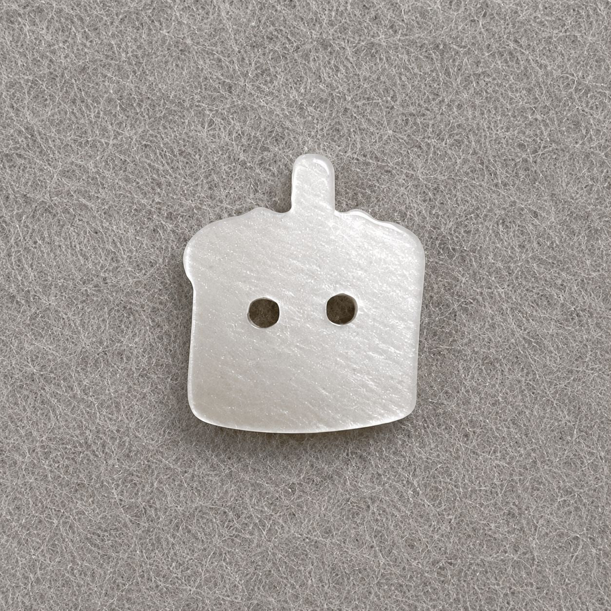 Resin button in white with top knob and two holes