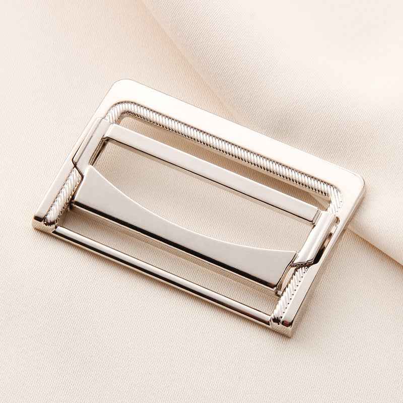 White/silver metal belt buckle with rectangular frame and center bar, 25–45mm