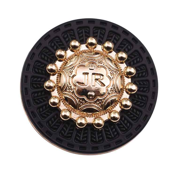 Round vintage metal shank button, gold-tone frame on dark base with bead surround