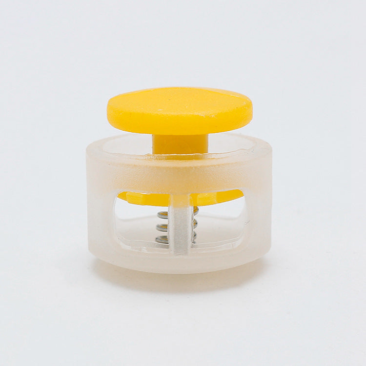17mm Schnurstopper mit Feder, gelber Knopf und transparenter Kunststofffassung