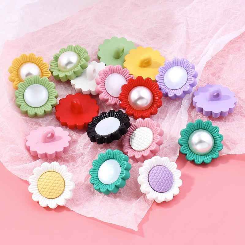 Assorted sunflower-shaped resin shank buttons with pearl centers in multiple colors