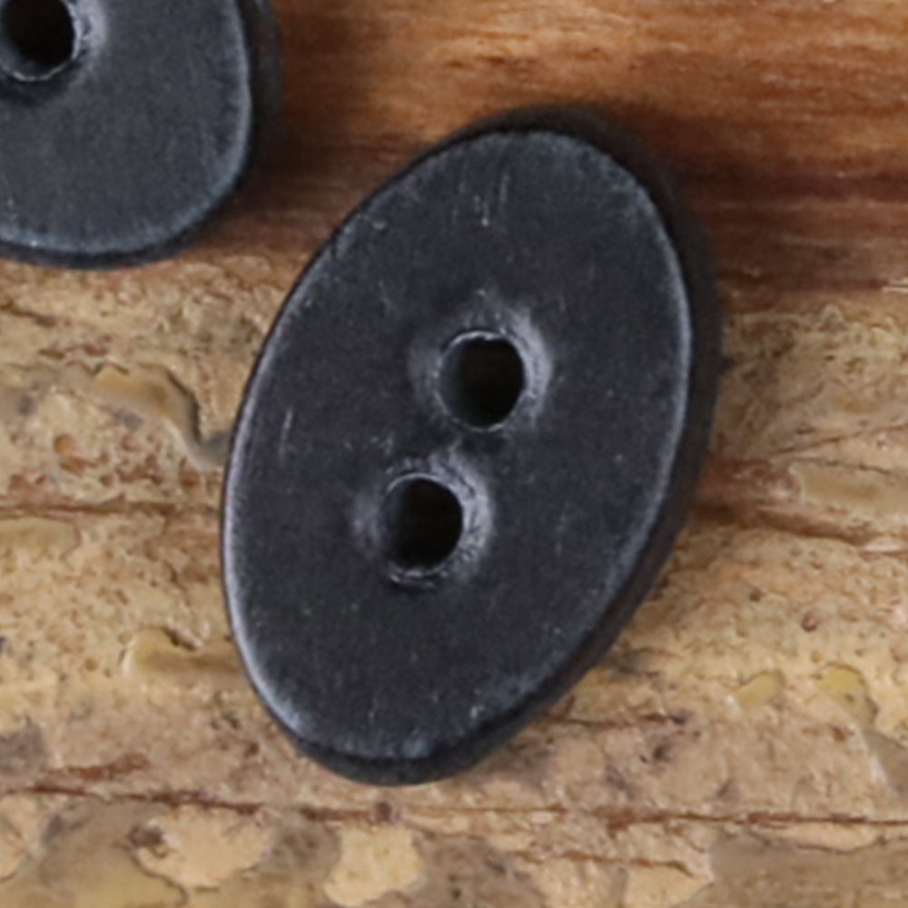 Dark gray novelty shirt button, oval with two holes