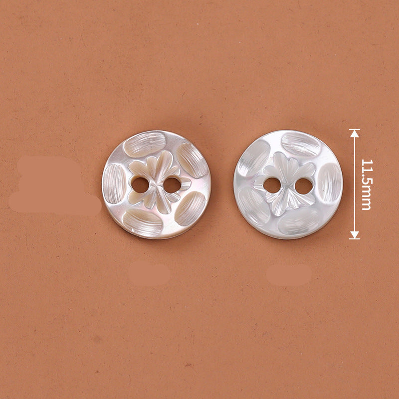 White 2-hole troca shell button with floral embossing, 11.5mm diameter