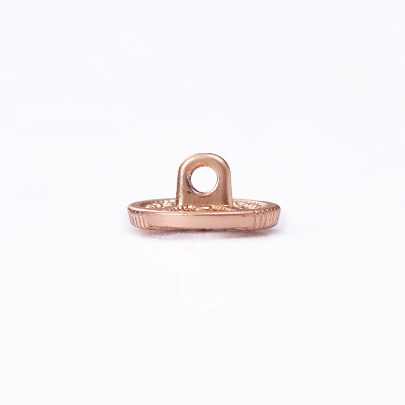 Rose gold-toned hollow shank button, round base with mounting loop, side view