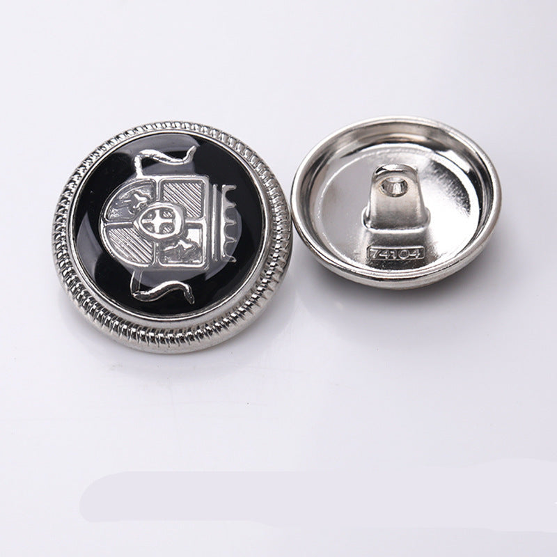Round crown enamel metal shank button, black enamel with gold-tone rim and crown detail