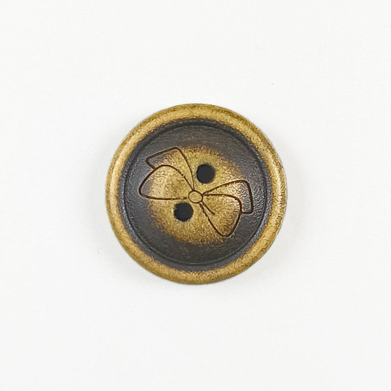 Round wood butterfly pattern button with two holes, dark blue center and gold edge