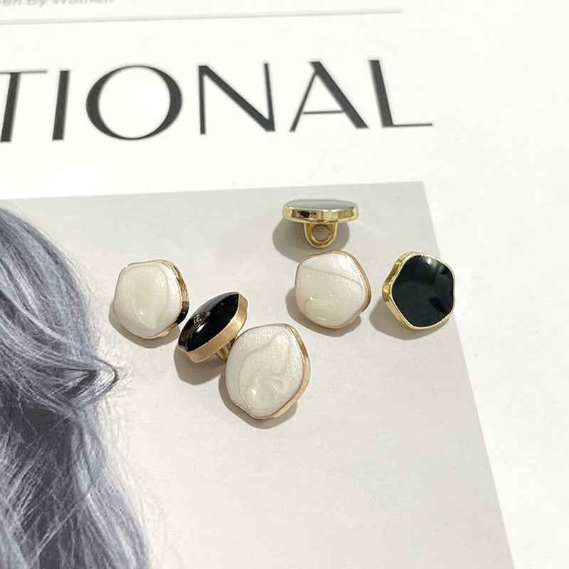10mm metal shank buttons showing front and back: white and black pearl-look