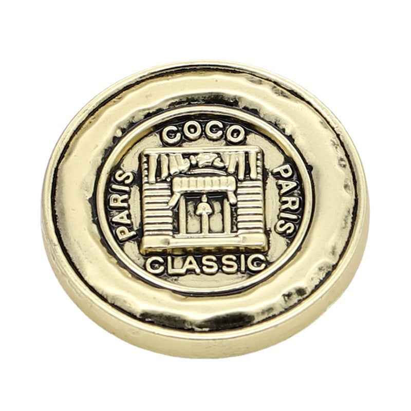 Light Gold metal shank button close-up, frosted Paris “CLASSIC” front detail