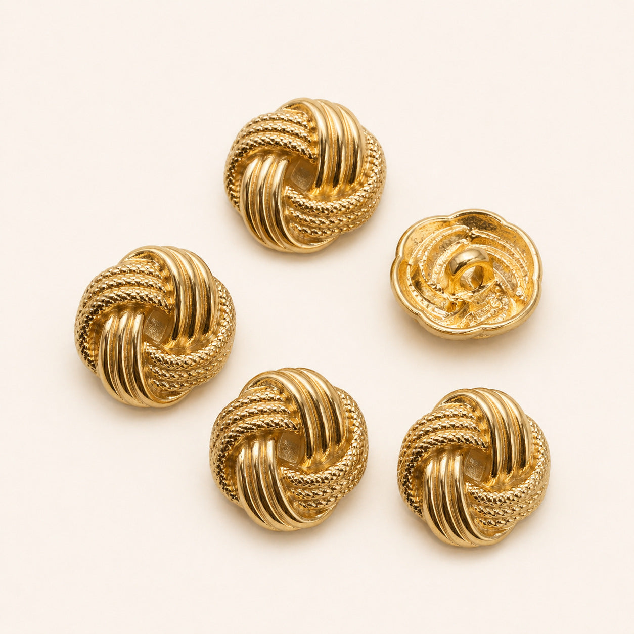 Gold Chinese knot shank buttons set, five round buttons front view with ridged patterns