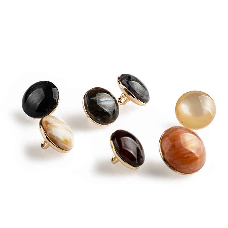 Assorted round resin buttons with metal backing and shank, mixed colors