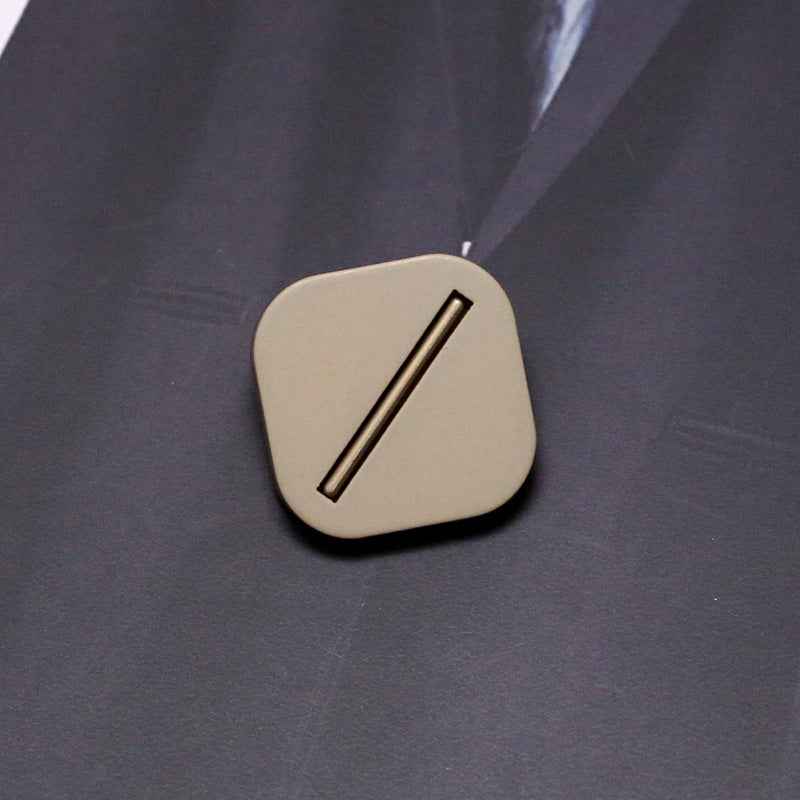 Black square resin shank button with metal base, single bar slot detail