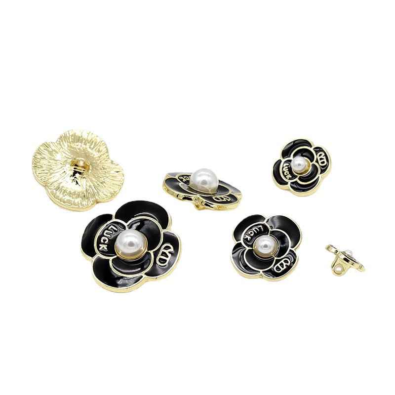 Mixed set of pearl petal metal shank buttons in black and white with gold backing