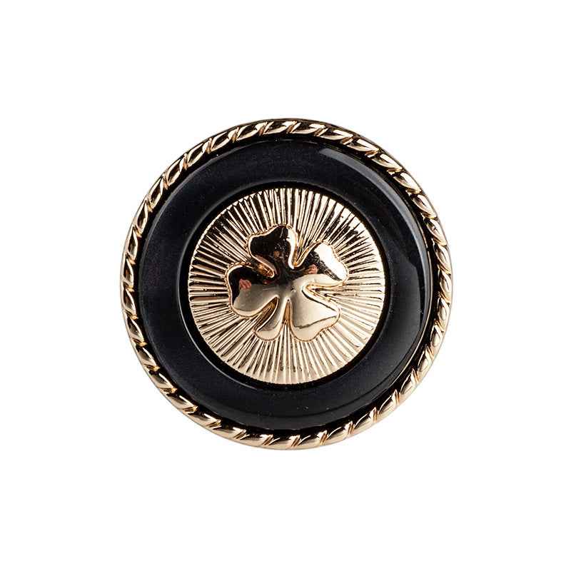 Black resin button with four-leaf clover design, gold border and metal shank