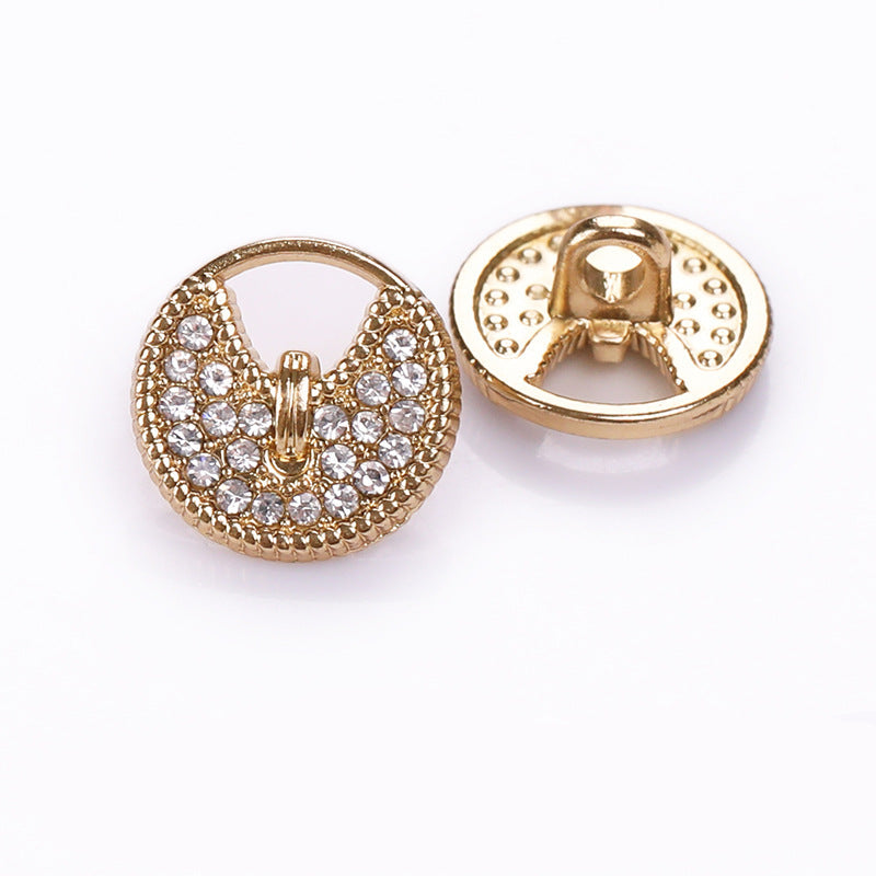 Round button with hollow metal shank, light gold finish and clear rhinestones, front and back