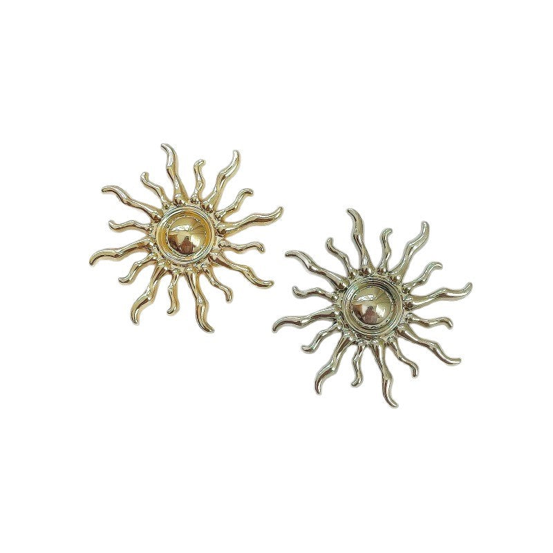 Sun-shaped metal shank button, gold-tone finish, round center detail
