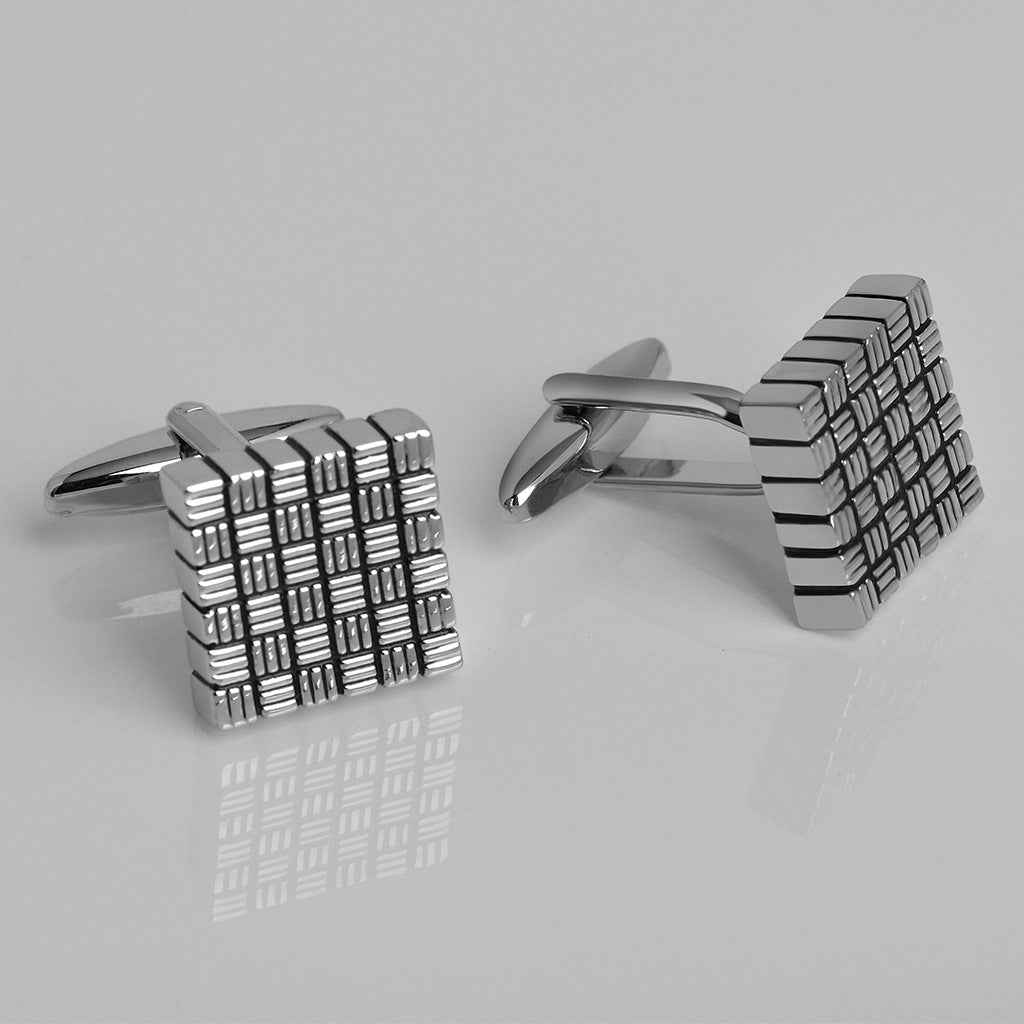 Pair of square striped cufflinks, silver with black oil finish, angled front view